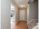 Inviting foyer with wood floors, staircase, and natural light from bay window at 535 Darby Glen Ln, Durham, NC 27713