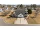 Overhead shot of a well-maintained home with a gray roof, green lawn, and an inviting driveway at 54 W Myrtle Dr # A, Angier, NC 27501