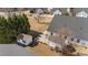 Aerial view of the backyard with a shed, patio, and landscaping on a well-maintained lawn at 54 W Myrtle Dr # A, Angier, NC 27501