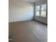 Spacious, unfinished bedroom with two windows, clean lines, and modern outlets at 58 Shay St, Angier, NC 27501