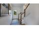 Bright entryway features wood-look flooring, a white door with glass, and a staircase at 58 Shay St, Angier, NC 27501