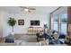 Inviting living room with hardwood floors, a ceiling fan, and natural light at 58 Shay St, Angier, NC 27501