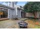 Backyard featuring patio area, fire pit, and foliage at 5840 Branchwood Rd, Raleigh, NC 27609