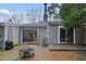 Backyard area including tables, chairs, grill, and string lights at 5840 Branchwood Rd, Raleigh, NC 27609