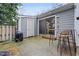 Outdoor patio with bar and stools, and a grill, perfect for entertaining guests at 5840 Branchwood Rd, Raleigh, NC 27609