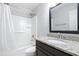 Bathroom featuring granite countertop, wood cabinet, and a shower with a white curtain at 5840 Branchwood Rd, Raleigh, NC 27609