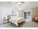 Bright bedroom with vaulted ceilings and sliding glass doors to a private outdoor space at 5840 Branchwood Rd, Raleigh, NC 27609
