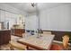 Bright dining area featuring a unique tile-top table and view to kitchen at 5840 Branchwood Rd, Raleigh, NC 27609