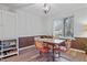 Charming dining room with stylish lighting and a view of the outdoors at 5840 Branchwood Rd, Raleigh, NC 27609