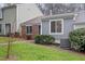 Exterior shot of house on a grassy lawn with bushes at 5840 Branchwood Rd, Raleigh, NC 27609