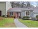 Charming townhouse featuring a well-manicured front yard and a welcoming red front door at 5840 Branchwood Rd, Raleigh, NC 27609