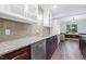 Bright kitchen showcases granite countertops, stainless steel appliances, and white and wood cabinets at 5840 Branchwood Rd, Raleigh, NC 27609