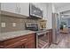 Modern kitchen featuring stainless steel appliances, granite countertops, and stylish backsplash at 5840 Branchwood Rd, Raleigh, NC 27609