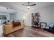 Inviting living room with modern flooring, a ceiling fan, and plenty of natural light at 5840 Branchwood Rd, Raleigh, NC 27609