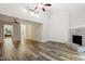 Bright and spacious living room features wood floors, a fireplace, and great natural light at 5840 Branchwood Rd, Raleigh, NC 27609
