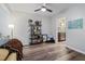 Spacious living area featuring a large window, modern flooring, and a view into the kitchen at 5840 Branchwood Rd, Raleigh, NC 27609