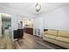 Stylish space with wood floors, comfortable seating, and an open concept to the kitchen at 5840 Branchwood Rd, Raleigh, NC 27609