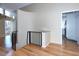 Bright foyer with hardwood floors and black railing at 6504 W Lake Anne Dr, Raleigh, NC 27612