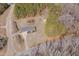 Aerial view of property featuring a long driveway, a house, shed, and wooded lot at 6605 Pearces Rd, Louisburg, NC 27549
