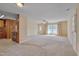 Open-concept living space with connecting kitchen area and large windows, offering great light at 6605 Pearces Rd, Louisburg, NC 27549