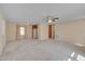 Open-concept living room seamlessly flowing into the kitchen area, providing a functional and inviting space at 6605 Pearces Rd, Louisburg, NC 27549
