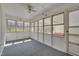 Bright sunroom featuring walls of windows, white ceilings, and neutral color carpet at 6605 Pearces Rd, Louisburg, NC 27549