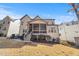 Back of home featuring screened in back porch and landscaped yard at 8013 Ghost Pony Trl, Raleigh, NC 27613