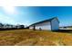 Back exterior view of a home with vinyl siding and a generous yard at 82 Asher Pointe Way, Benson, NC 27504