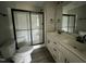 Bright bathroom features double vanity with modern fixtures and a glass-enclosed shower at 82 Asher Pointe Way, Benson, NC 27504