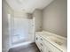 Bright bathroom features a shower and double vanity with black hardware at 82 Asher Pointe Way, Benson, NC 27504