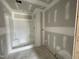 Bathroom under construction featuring a shower and raw walls ready for final touches and finishing touches at 82 Asher Pointe Way, Benson, NC 27504