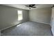 Bedroom featuring neutral walls, carpeted floors, and a large window at 82 Asher Pointe Way, Benson, NC 27504