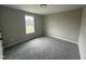 This carpeted bedroom has a window that brings in natural light at 82 Asher Pointe Way, Benson, NC 27504