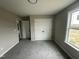 This bedroom features grey carpet, neutral walls, and a closet at 82 Asher Pointe Way, Benson, NC 27504