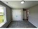 Bedroom featuring carpeted floor, closet, and window with exterior view at 82 Asher Pointe Way, Benson, NC 27504