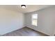 Bright bedroom with modern flooring, large window, and lots of natural light at 82 Asher Pointe Way, Benson, NC 27504