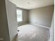 Bedroom with a window and neutral walls, ready for personalization and comfort at 82 Asher Pointe Way, Benson, NC 27504
