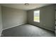 This carpeted bedroom has a window that brings in natural light at 82 Asher Pointe Way, Benson, NC 27504