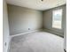 Bright bedroom featuring a neutral color palette and natural light from a window at 82 Asher Pointe Way, Benson, NC 27504