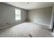 Bright bedroom featuring a neutral color palette and natural light from a window at 82 Asher Pointe Way, Benson, NC 27504
