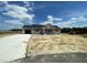 New construction home featuring gray siding, a garage, and a long concrete driveway at 82 Asher Pointe Way, Benson, NC 27504