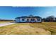 Charming home with white siding, black shutters, and a two-car garage at 82 Asher Pointe Way, Benson, NC 27504