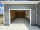 Spacious, unfinished two-car garage with concrete floor and wood frame in a new home at 82 Asher Pointe Way, Benson, NC 27504