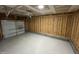 Unfinished garage featuring concrete floor and exposed structural elements at 82 Asher Pointe Way, Benson, NC 27504