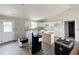 Modern kitchen featuring white cabinets, granite countertops, and a center island at 82 Asher Pointe Way, Benson, NC 27504