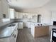 Modern kitchen featuring white cabinets, granite countertops, and a center island at 82 Asher Pointe Way, Benson, NC 27504