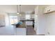 Bright kitchen featuring white cabinets, granite countertops, stainless appliances and a breakfast bar at 82 Asher Pointe Way, Benson, NC 27504