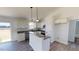 Modern kitchen with granite countertops, stainless steel appliances, and an adjacent dining area at 82 Asher Pointe Way, Benson, NC 27504