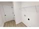 Functional laundry room with a wire rack, ready for appliances, and featuring durable vinyl flooring at 82 Asher Pointe Way, Benson, NC 27504