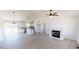 Bright, open living space featuring vaulted ceilings, a fireplace, and views into the kitchen at 82 Asher Pointe Way, Benson, NC 27504